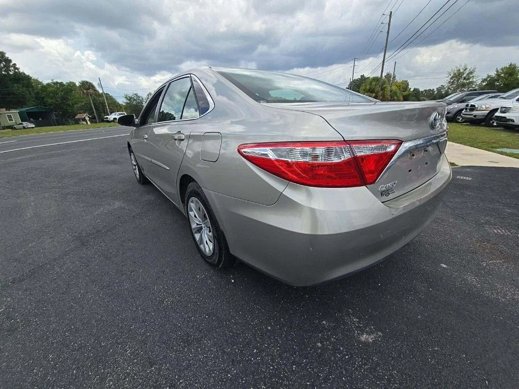 Used 2017 Gold Toyota LE image 2