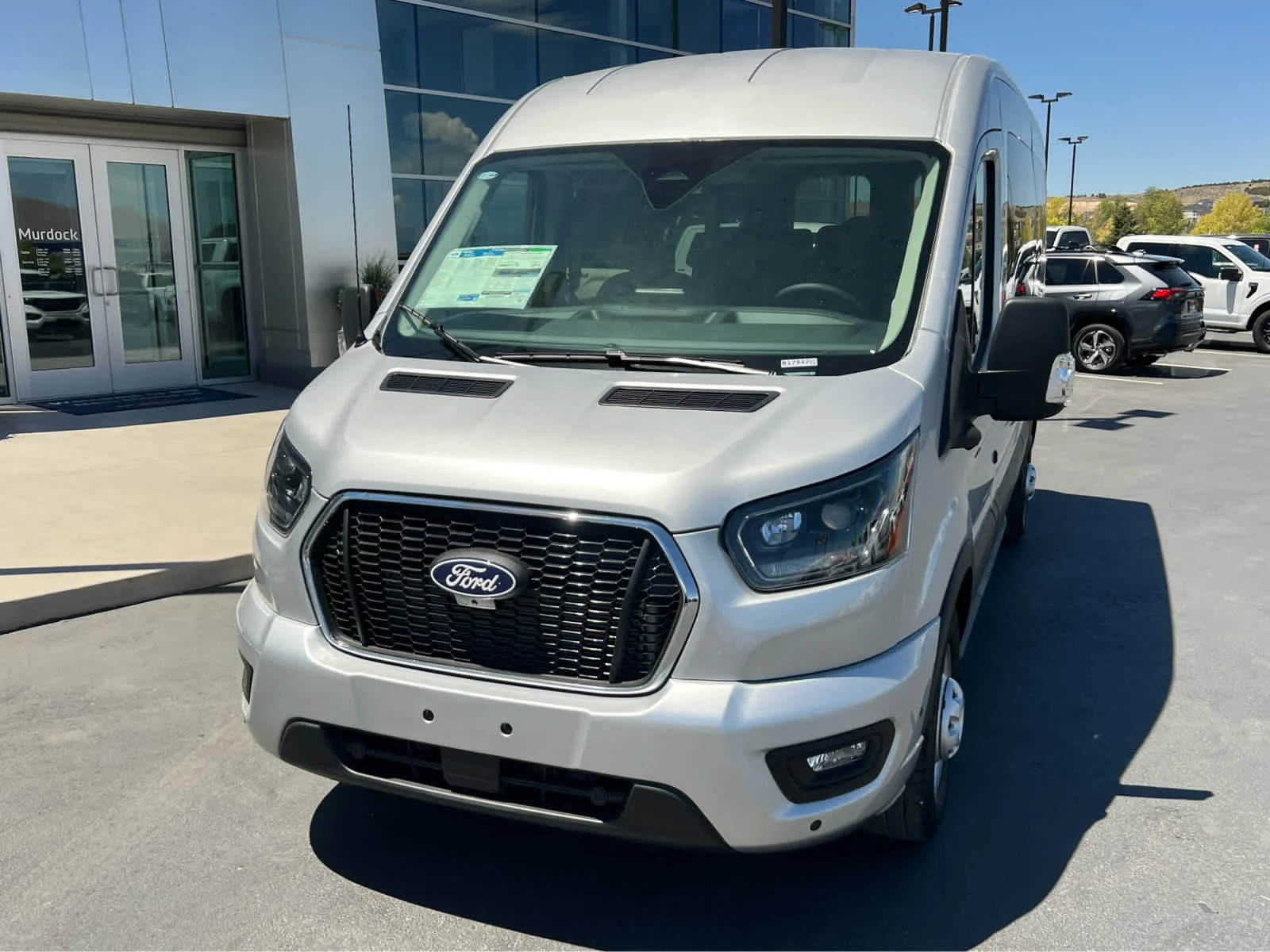 New 2026 Ingot Silver Metallic Ford Passenger Van XLT image 2