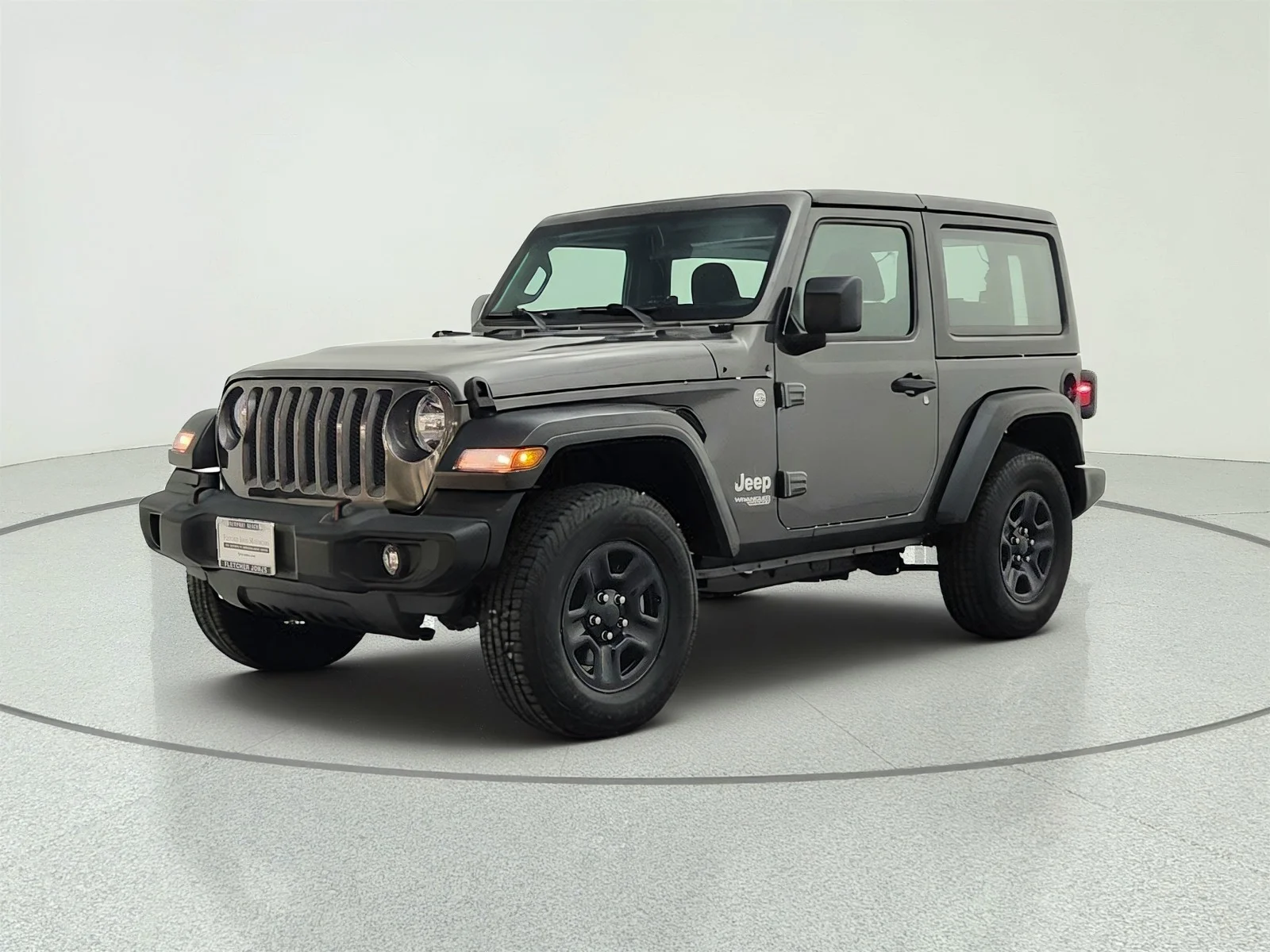 Used 2018 Granite Crystal Metallic Clearcoat Jeep Sport image 1