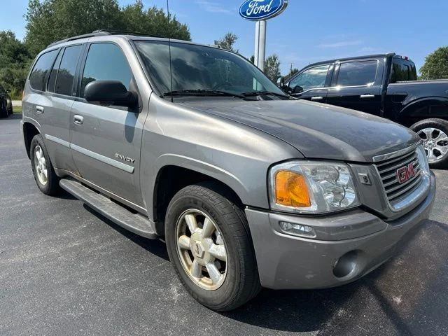 Used 2006 GMC Envoy SLT with VIN 1GKDT13S562197549 for sale in Manistee, MI