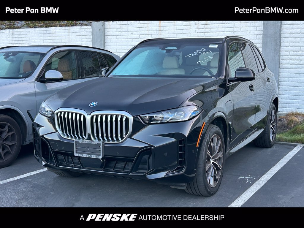 Certified Used 2024 Black Sapphire Metallic BMW xDrive50e image 1