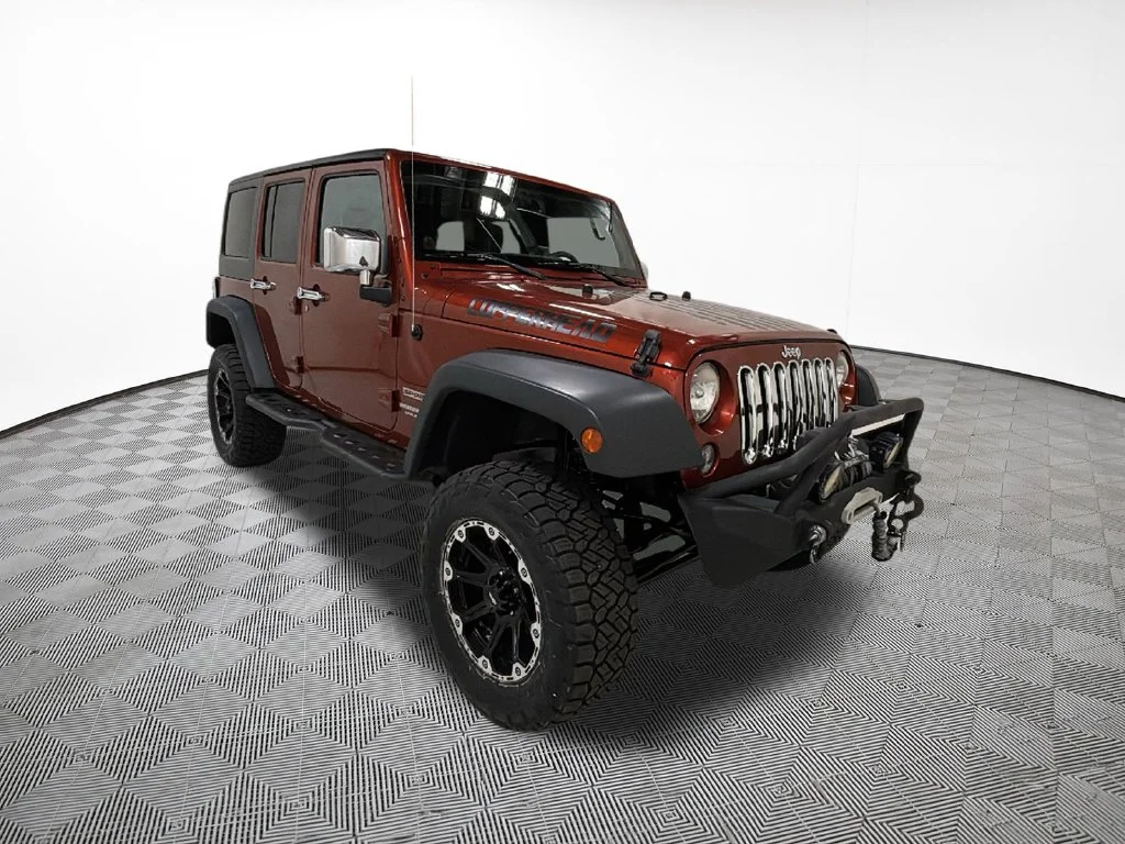 Used 2014 Orange Jeep Unlimited Sport image 4