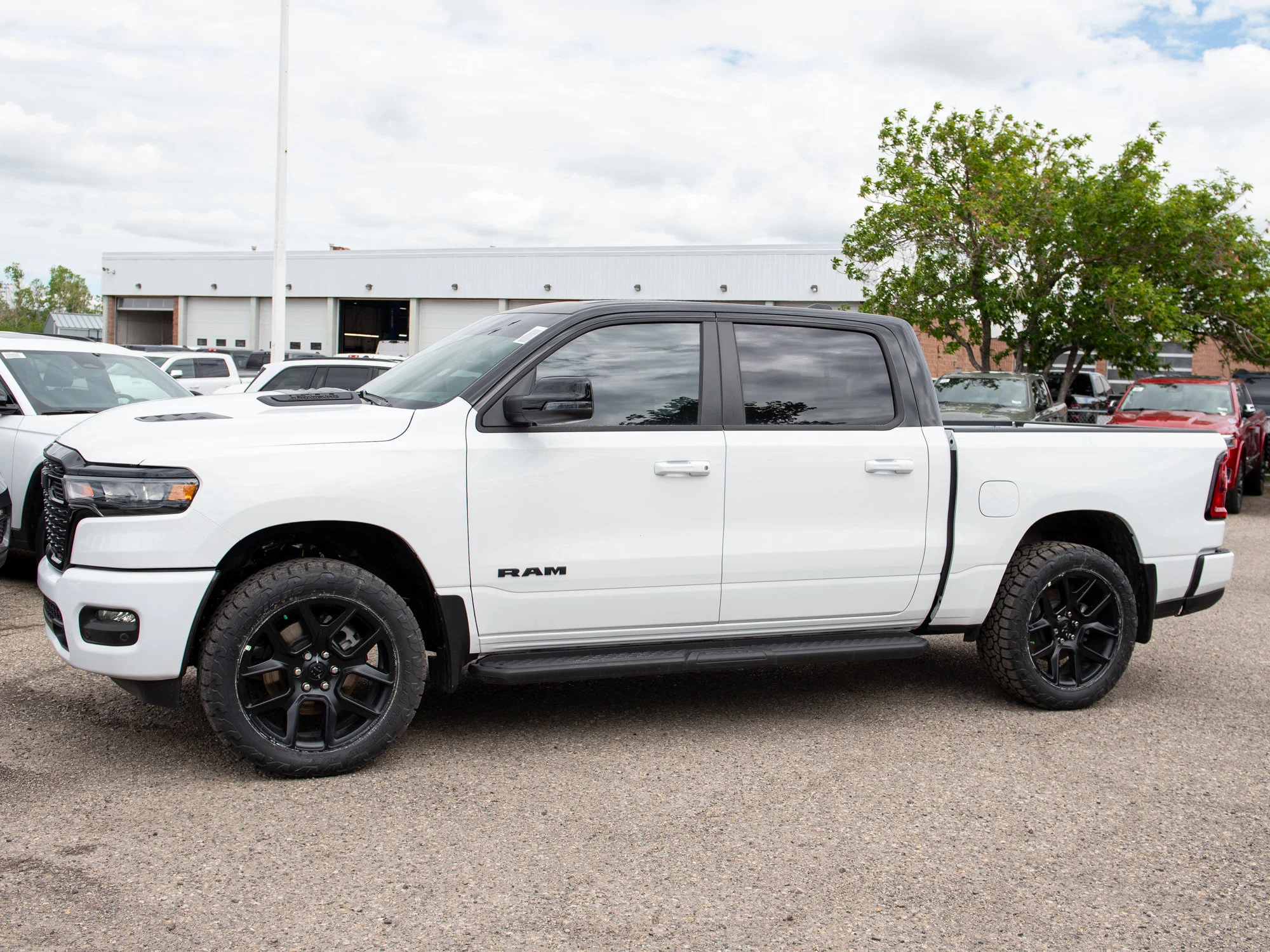 New 2026 White RAM Sport*, 2 Inch Lift, 33 Inch Tires image 2