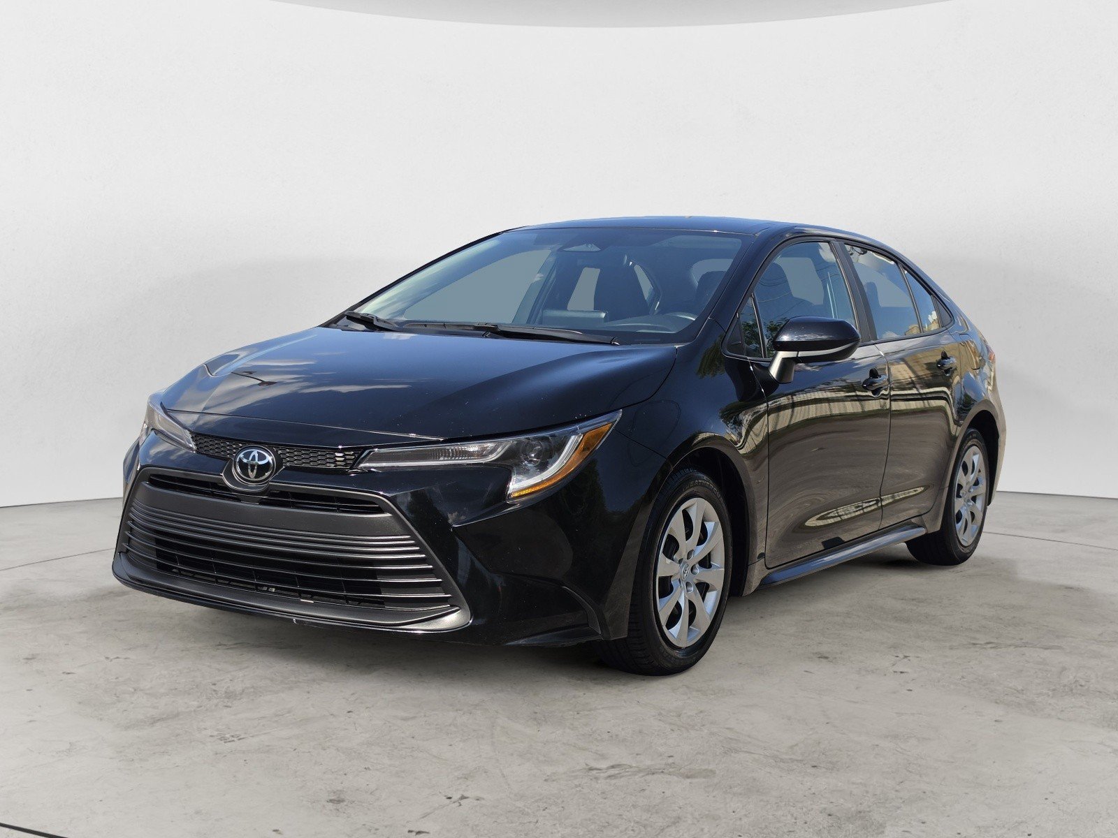Used 2024 Midnight Black Metallic Toyota LE image 6