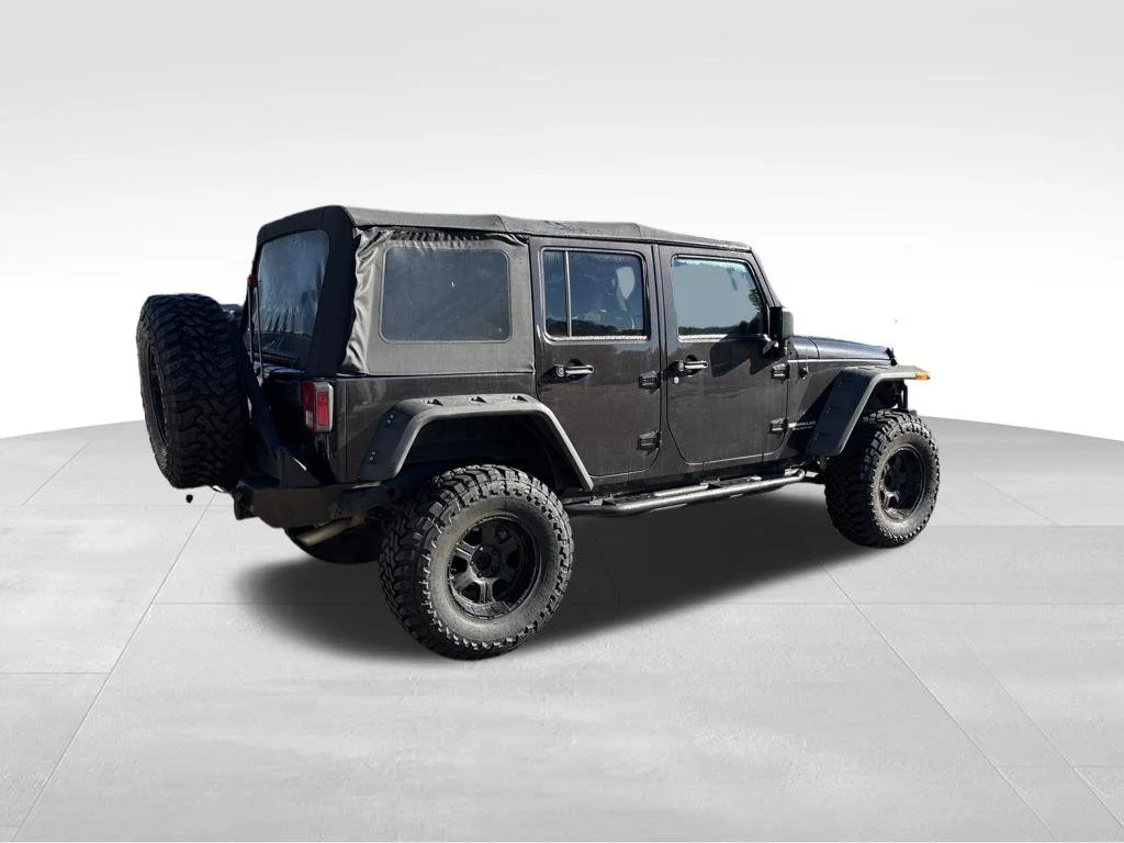 Used 2013 Brown Jeep Unlimited Sport image 3