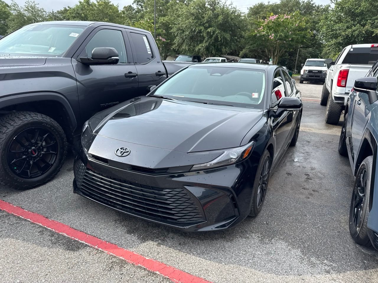 Used 2025 Black Toyota LE image 1