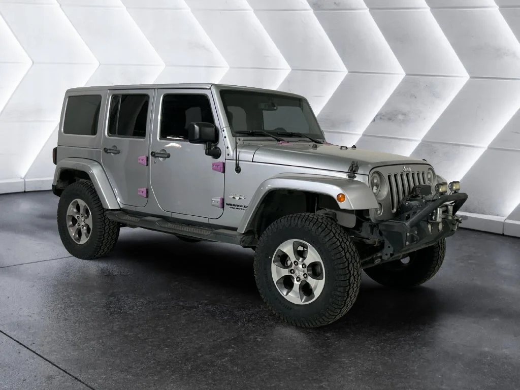 Used 2016 Silver Jeep Unlimited Sahara image 1