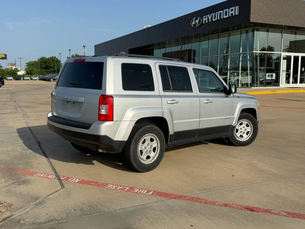 Used 2011 Bright Silver Metallic Clearcoat Jeep Sport image 6
