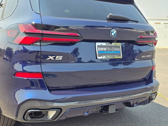 New 2026 Tanzanite Blue II Metallic BMW xDrive50e image 7