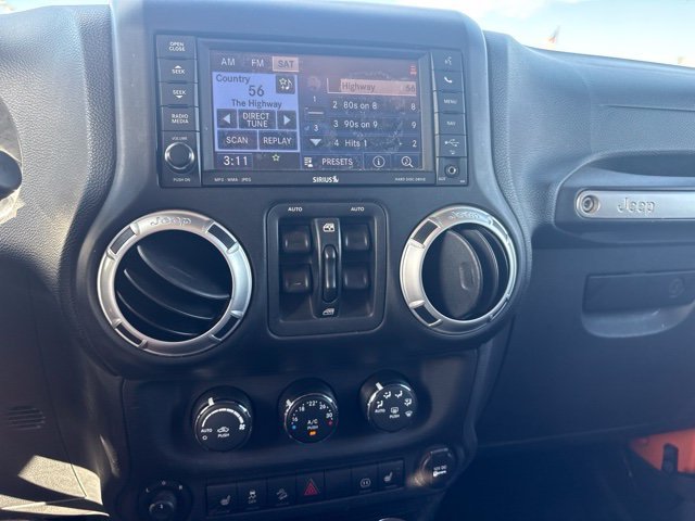 Used 2012 Orange Jeep Unlimited Sahara image 8