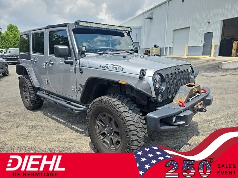 Used 2014 Gray Jeep Unlimited Sport image 1