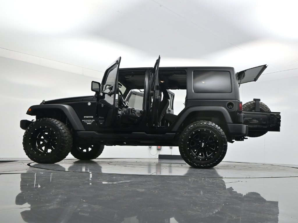 Used 2014 Black Clearcoat Jeep Unlimited Sport image 58