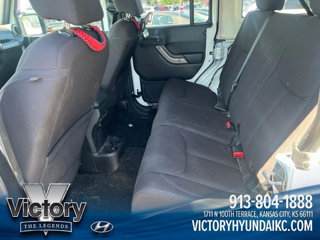 Used 2013 White Jeep Unlimited Sport image 9