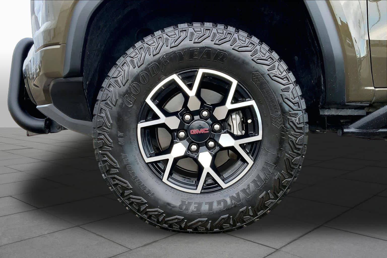Used 2024 Deep Bronze Metallic GMC 4WD AT4X image 11