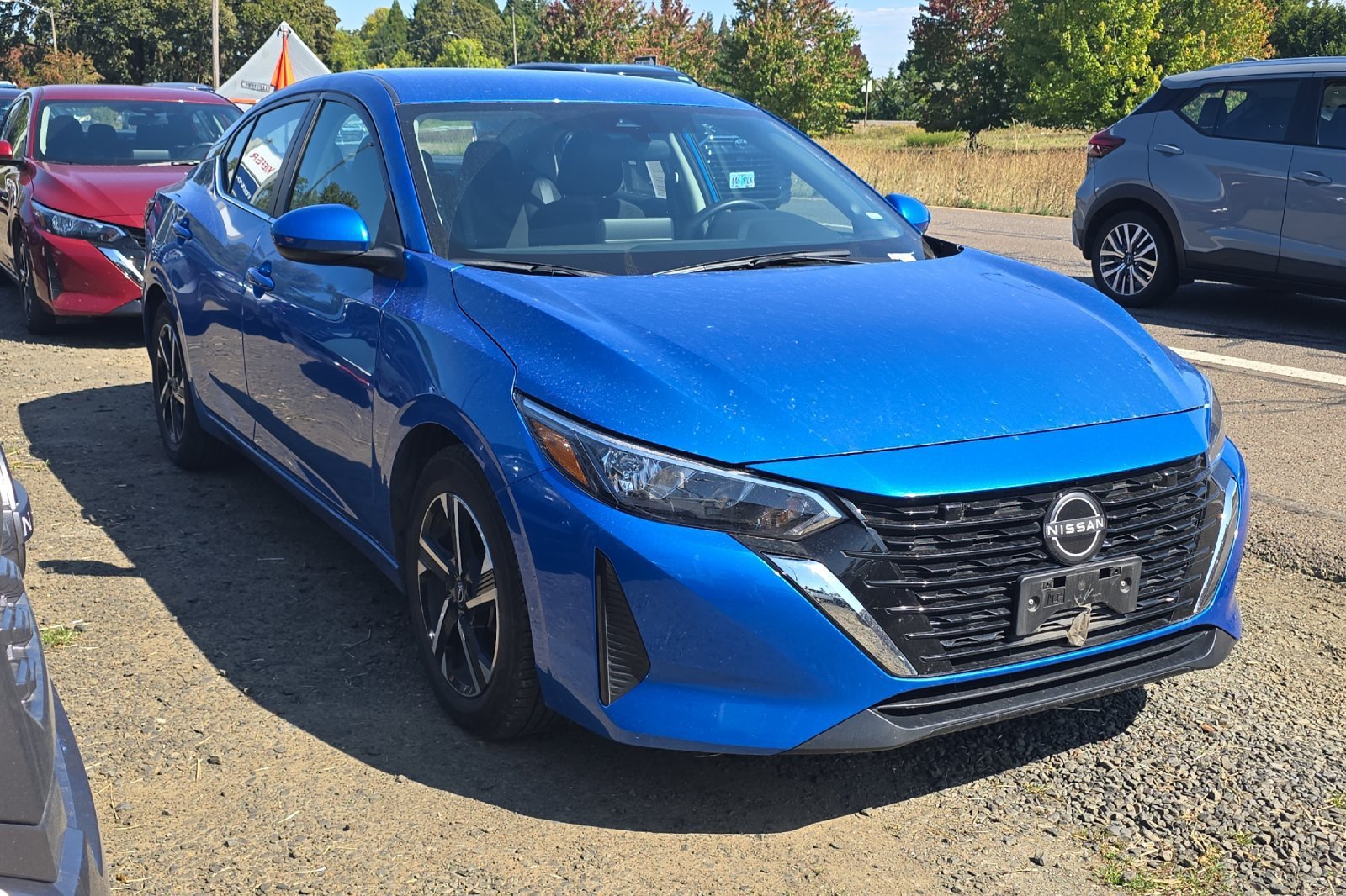 Used 2024 Electric Blue Metallic Nissan SV image 2