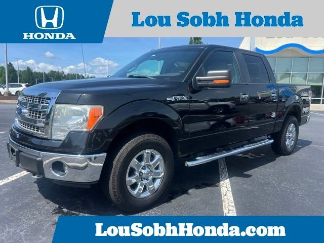 Used 2014 Tuxedo Black Metallic Ford XLT image 1