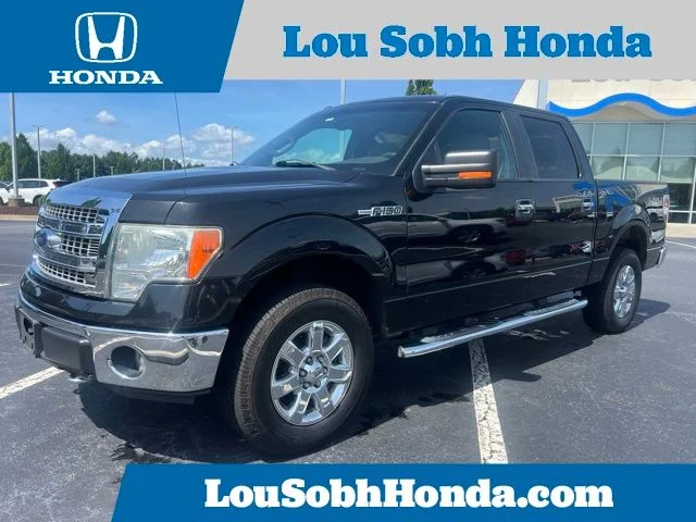 Used 2014 Tuxedo Black Metallic Ford XLT image 1