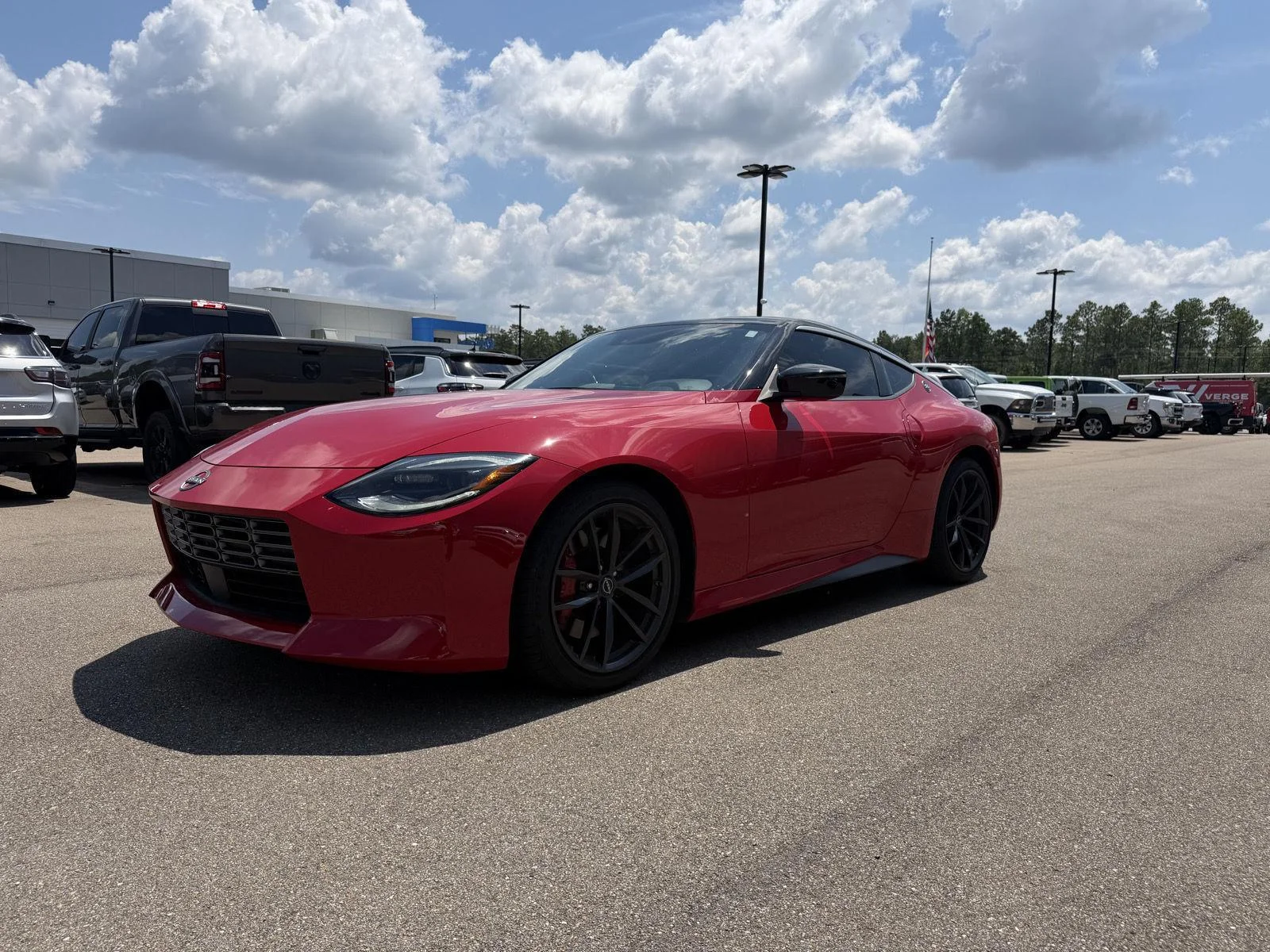 Used 2025 Solid Red/Super Black Nissan Performance image 1