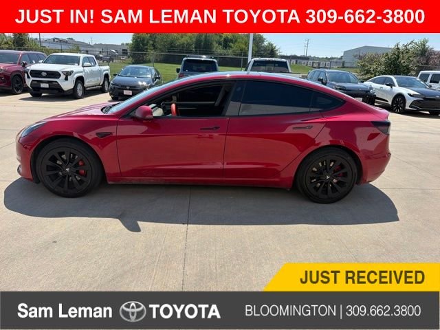 Used 2022 Red Tesla Base image 1