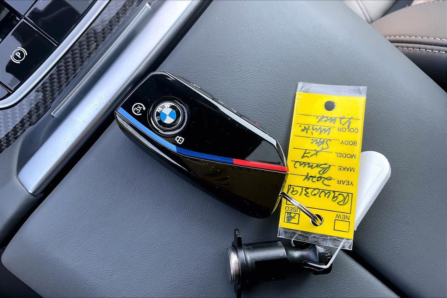 Certified Used 2024 Mineral White Metallic BMW M60i image 14