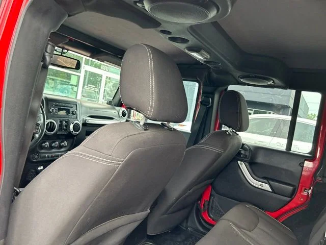 Used 2014 Red Jeep Unlimited Sahara image 18