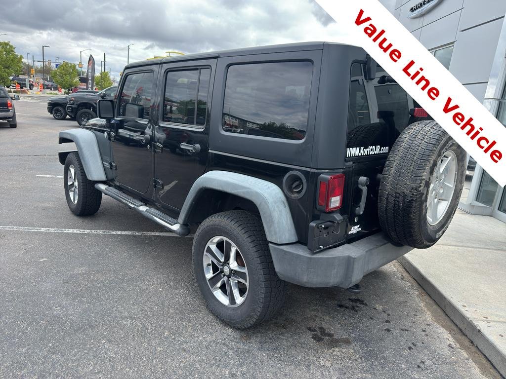 Used 2011 Black Clearcoat Jeep Sport image 3