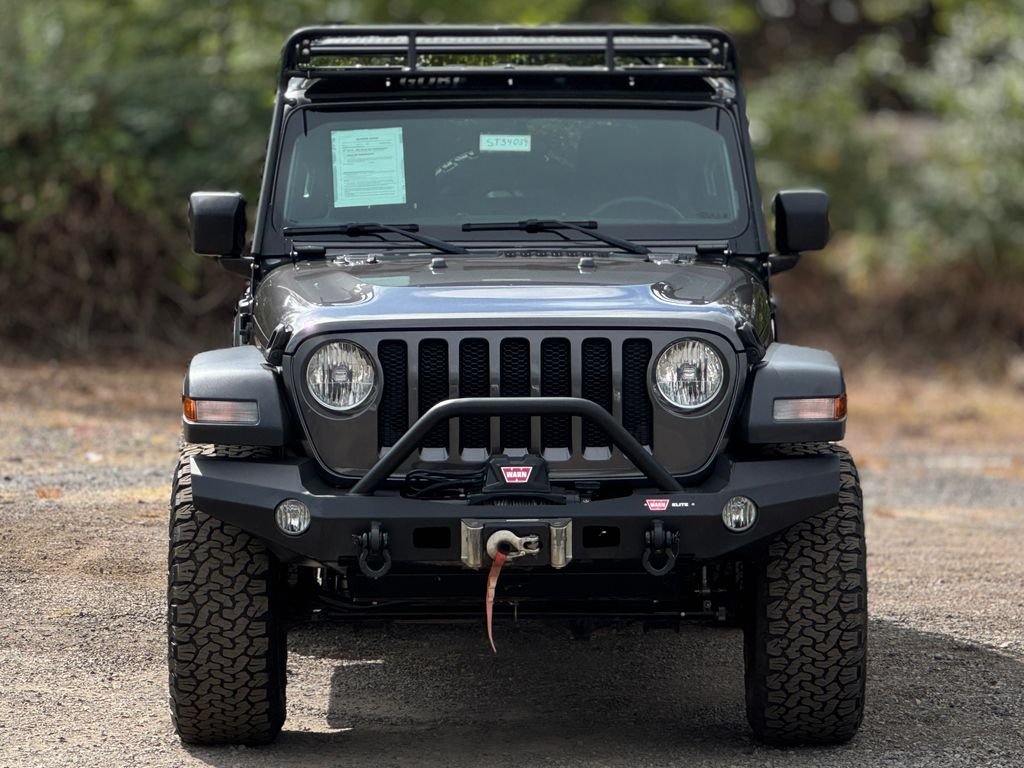 Used 2018 Granite Crystal Metallic Clearcoat Jeep Unlimited Sport S image 1