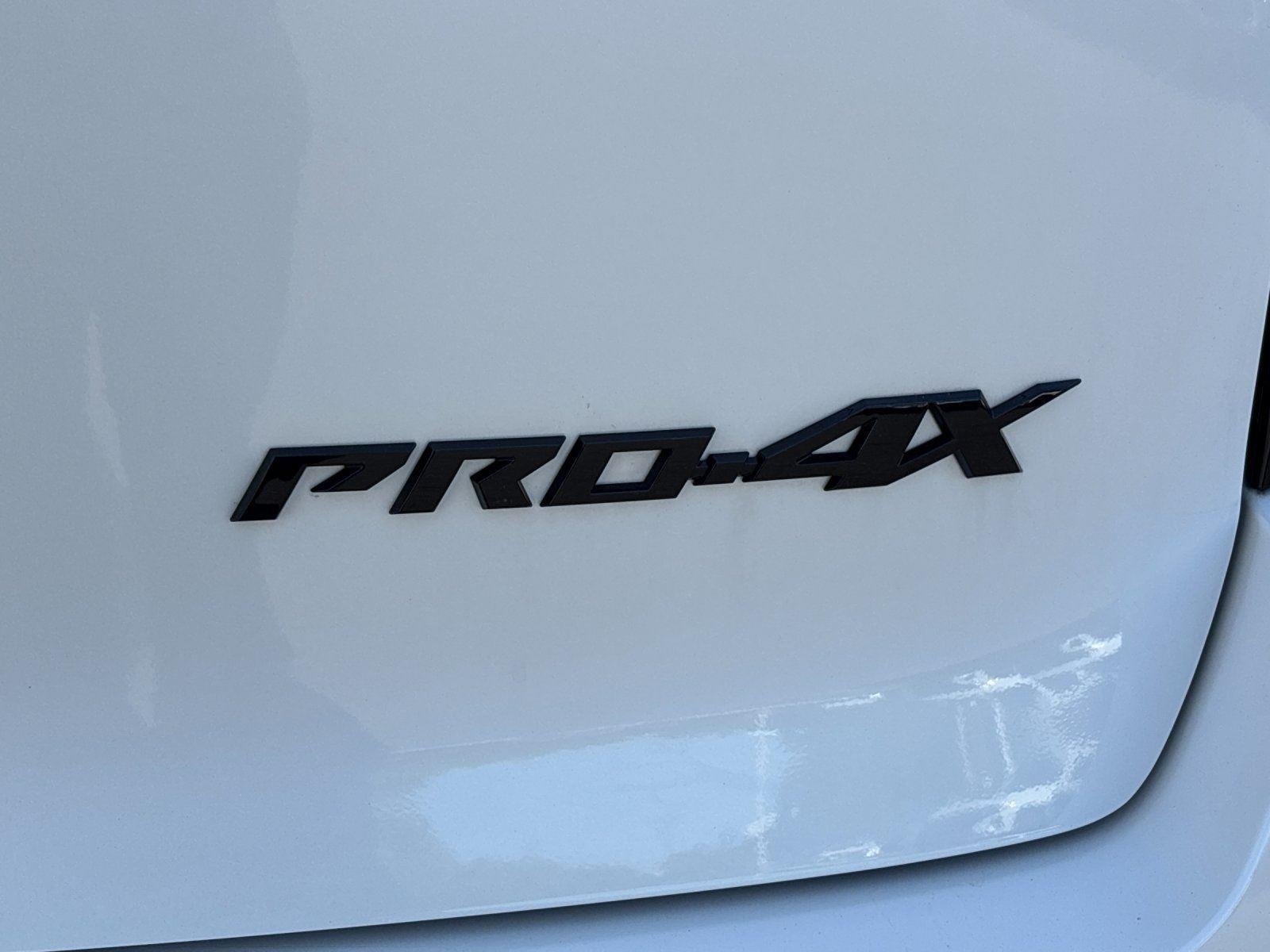 Used 2025 Aspen White Tricoat/Super Black Nissan PRO-4X image 11