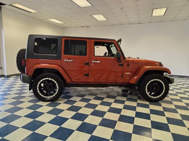 Used 2009 Orange Jeep Unlimited Sahara image 8