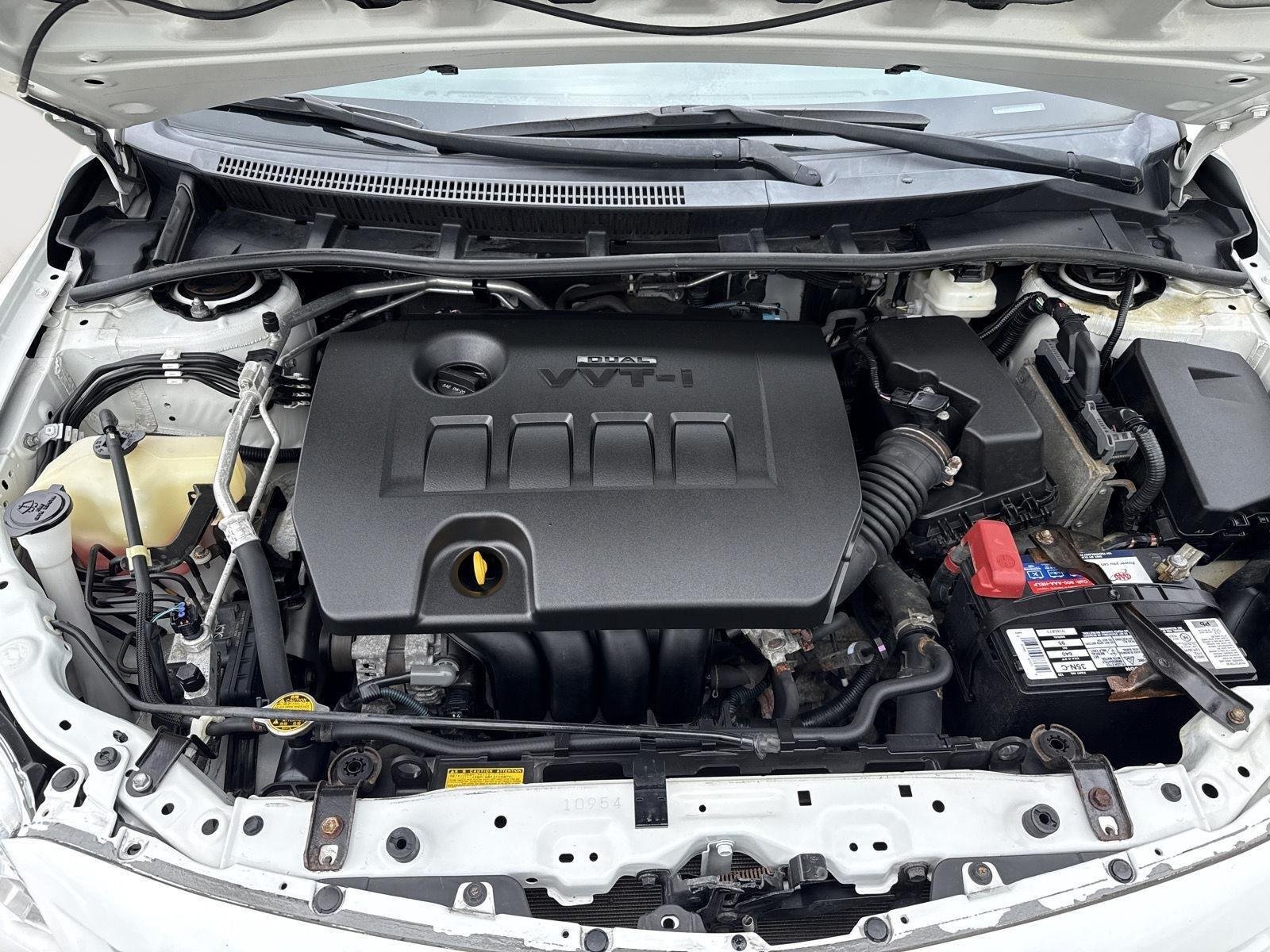 Used 2013 Super White Toyota LE image 8
