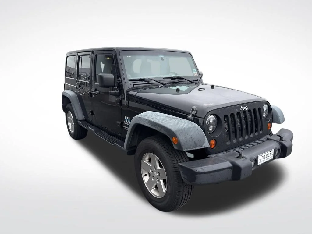 Used 2012 Black Jeep Unlimited Sport image 11