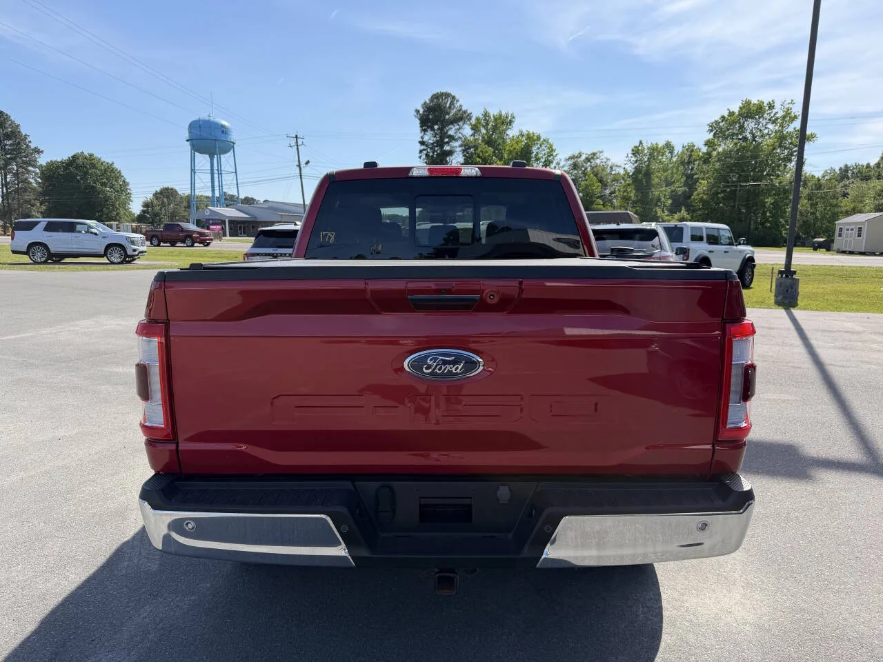 Certified Used 2023 Red Ford Lariat 4x4 4dr SuperCrew 5.5 ft. SB image 4