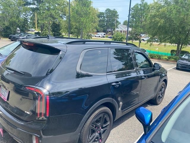 Used 2025 Black Kia EX X-Line image 4