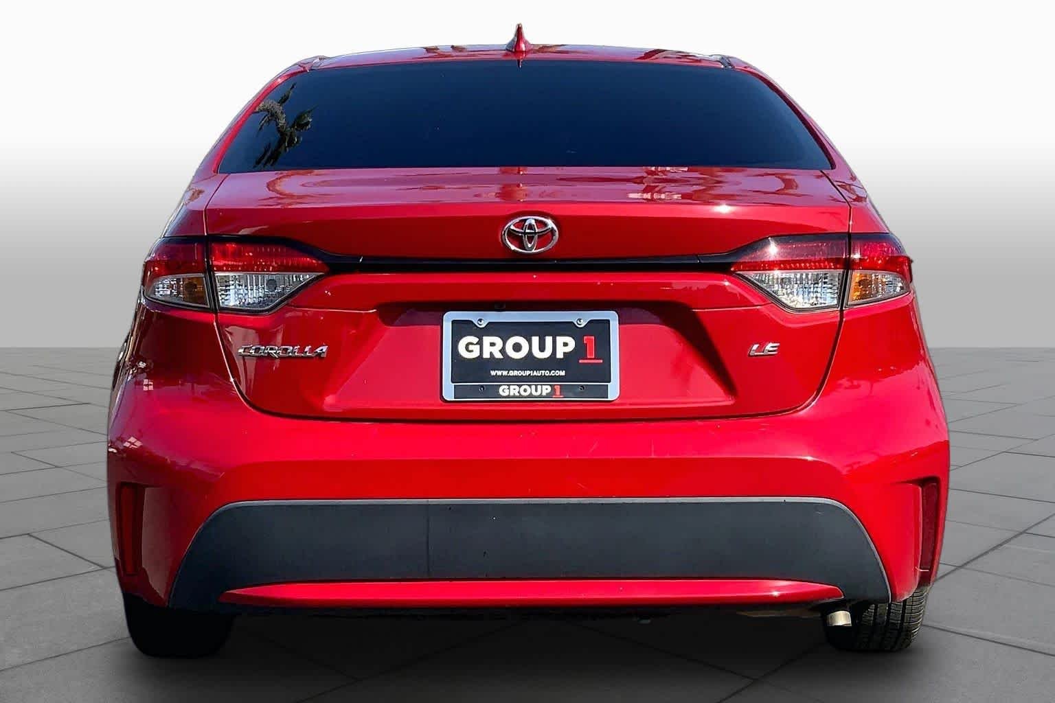 Used 2021 Barcelona Red Metallic Toyota LE image 4