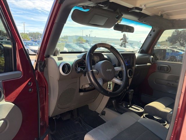 Used 2010 Red Jeep Unlimited Sahara image 24