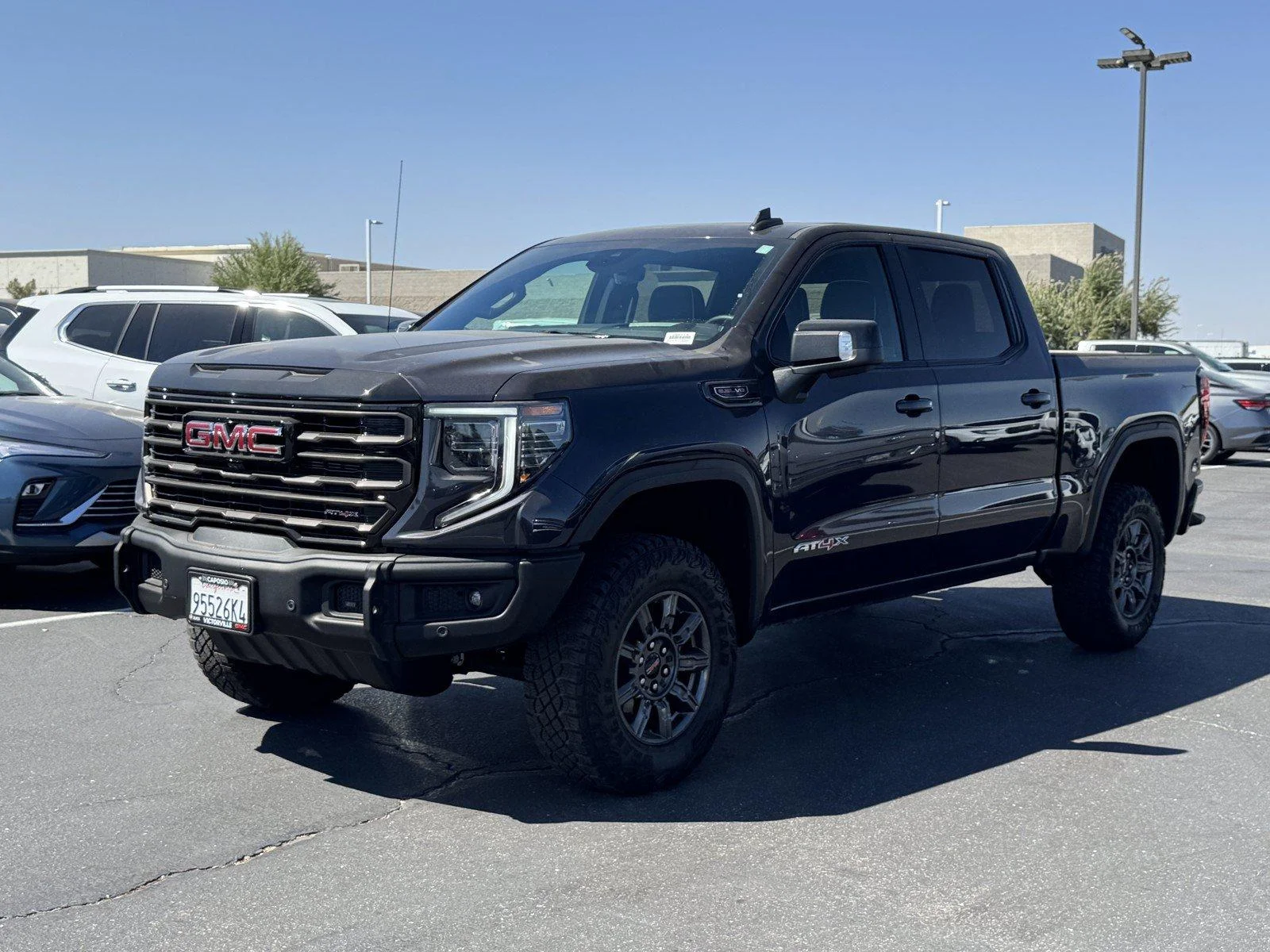 New 2026 TITANIUM RUSH METALLIC GMC AT4X image 3