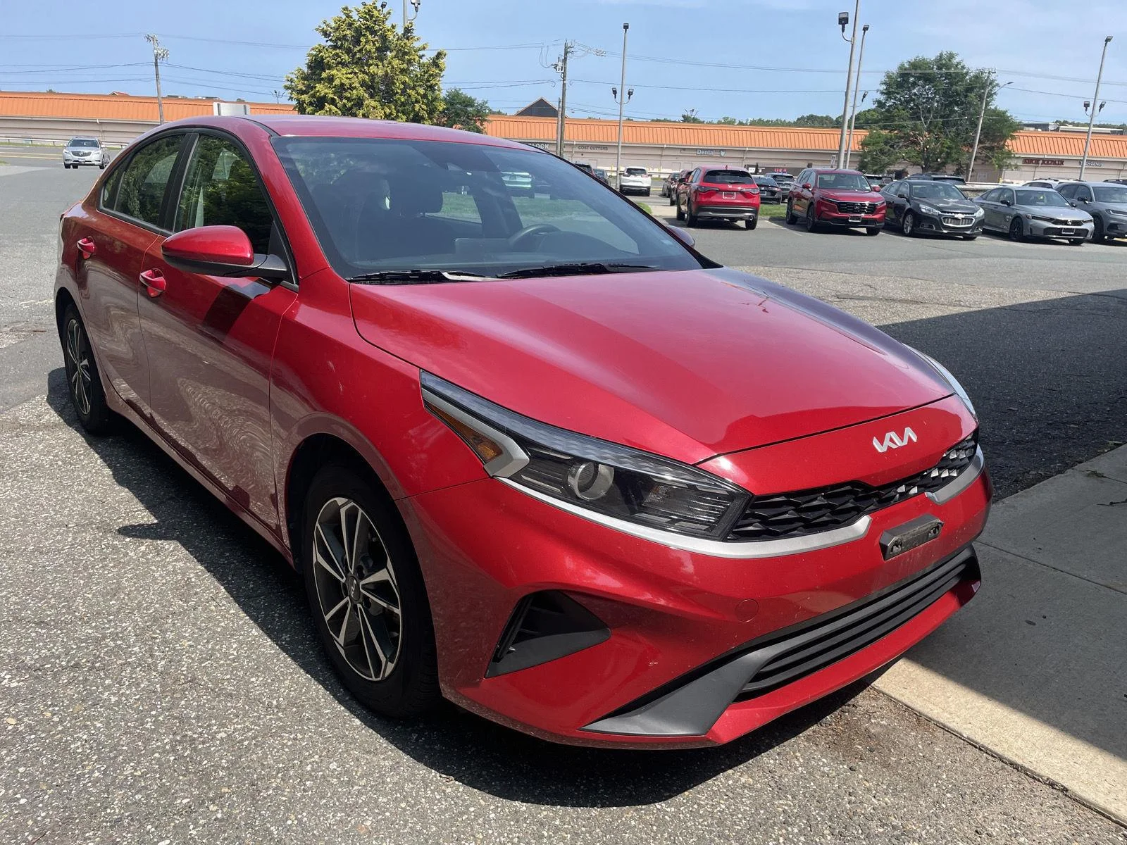 Used 2023 Currant Red Kia LXS image 1