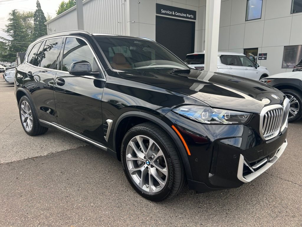 Used 2024 Black Sapphire Metallic BMW xDrive40i image 1