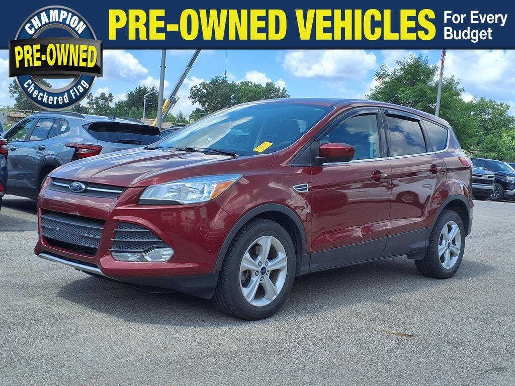 Used 2014 Orange Ford SE image 1