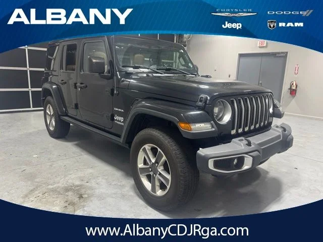 Used 2020 Black Jeep Unlimited Sahara image 1