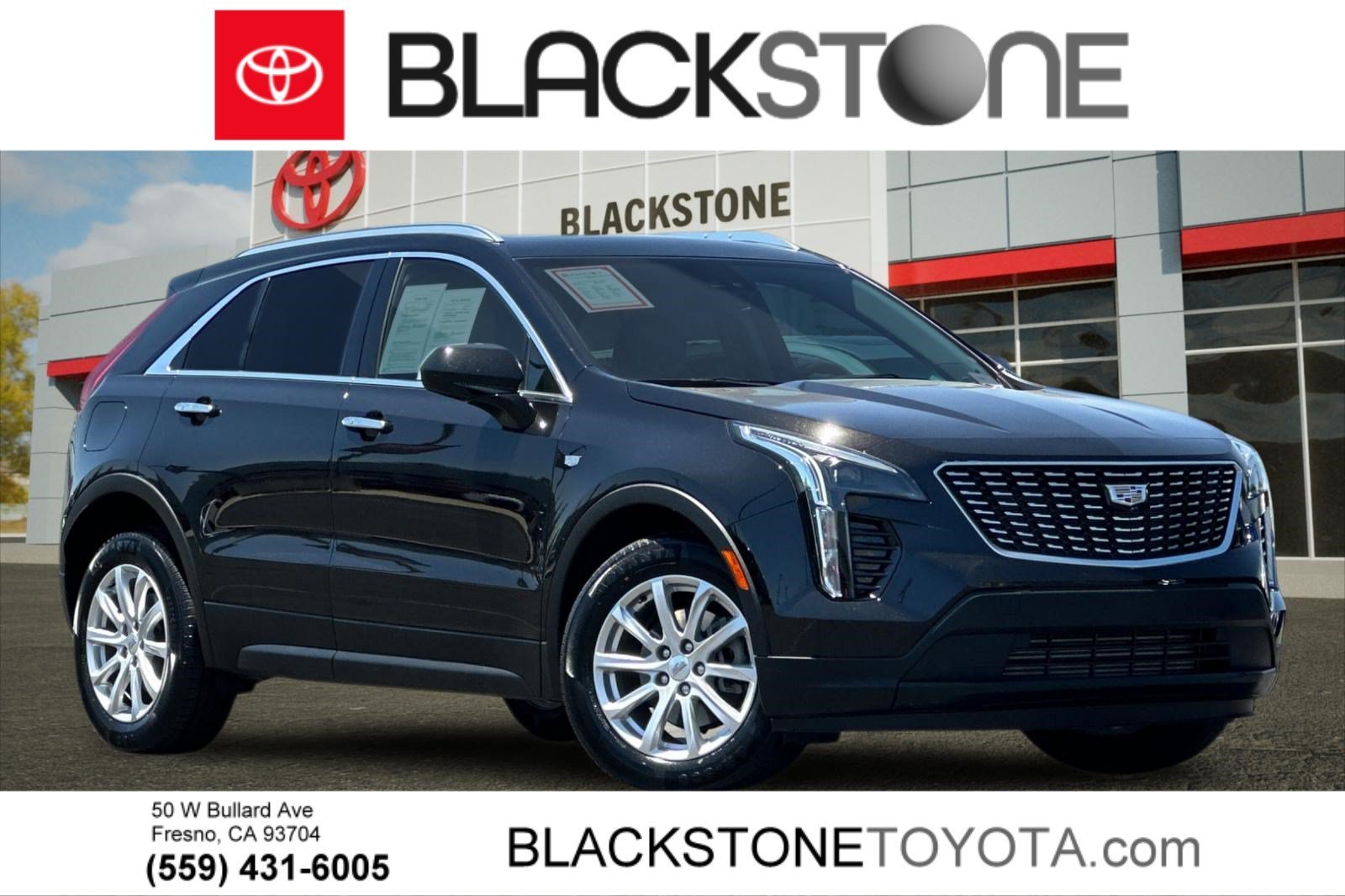 Used 2021 Stellar Black Metallic Cadillac FWD Luxury image 1