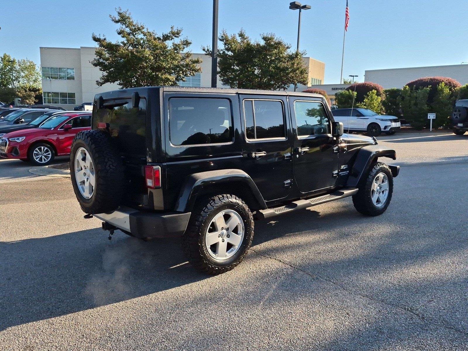 Used 2011 Black Clear Coat Jeep Sahara image 4