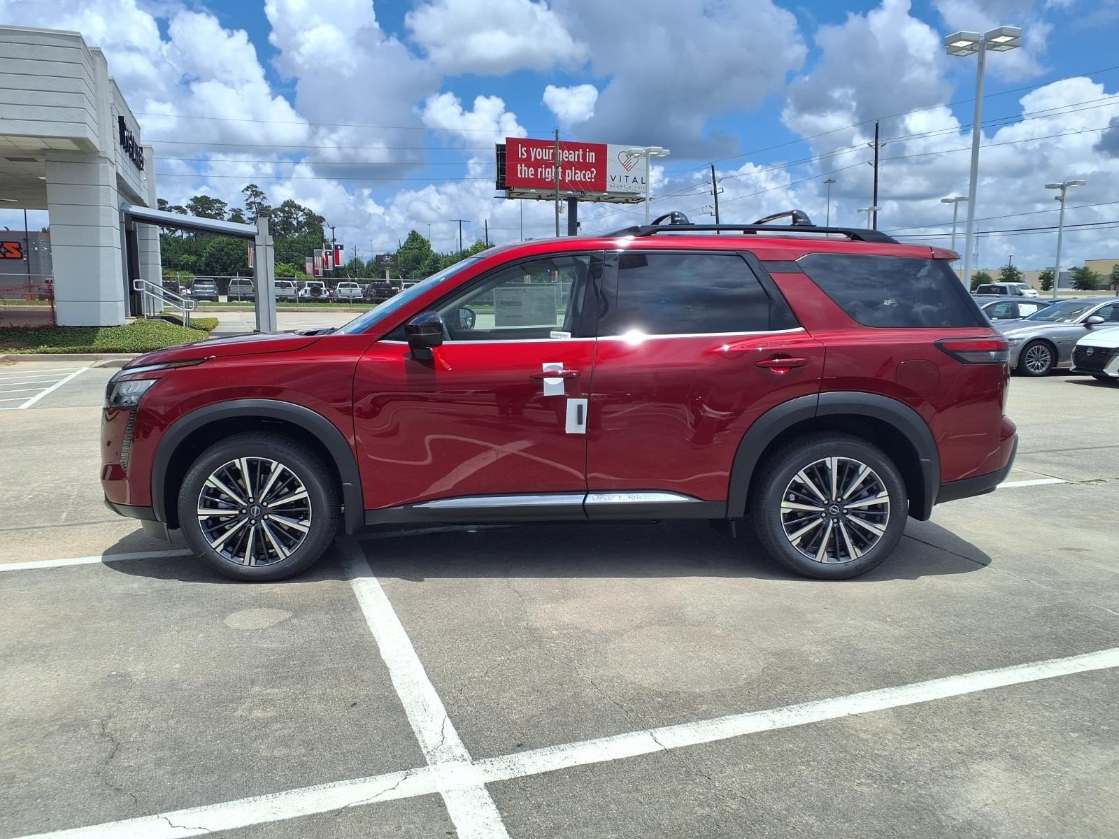 2026 Nissan Pathfinder Platinum Red at Robbins Nissan
