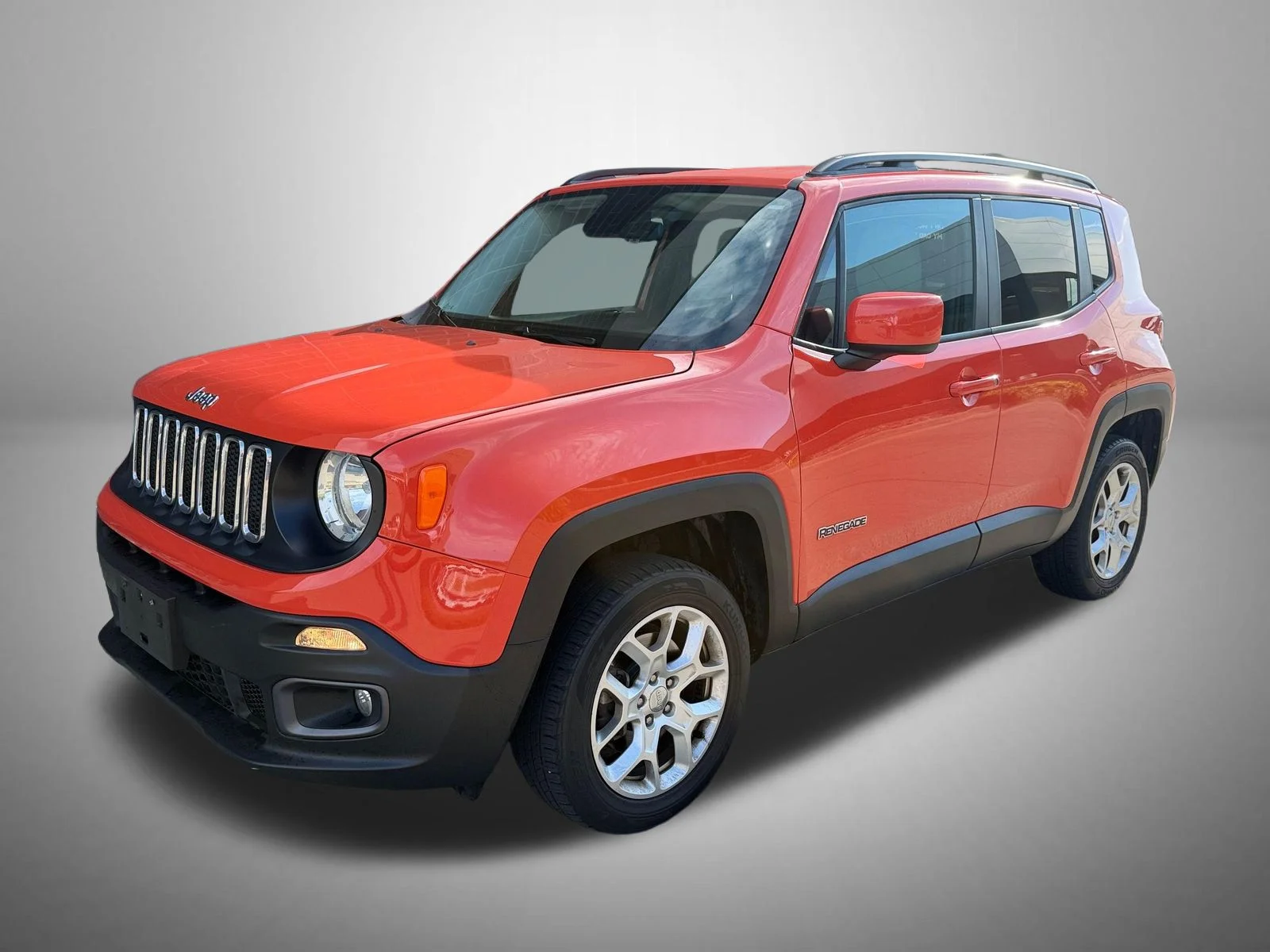 Used 2017 Orange Jeep Latitude image 1