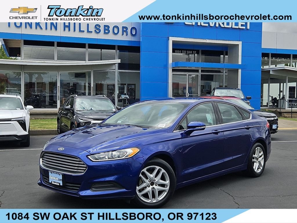 Used 2014 Blue Metallic Ford SE image 1