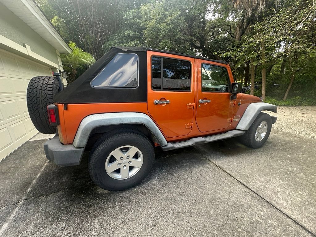 Used 2011 Mango Tango Pearl Jeep Sport image 3