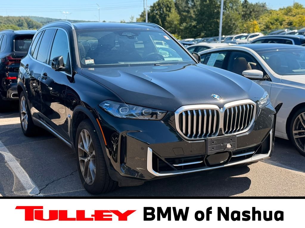 Certified Used 2024 Black Sapphire Metallic BMW xDrive40i image 1