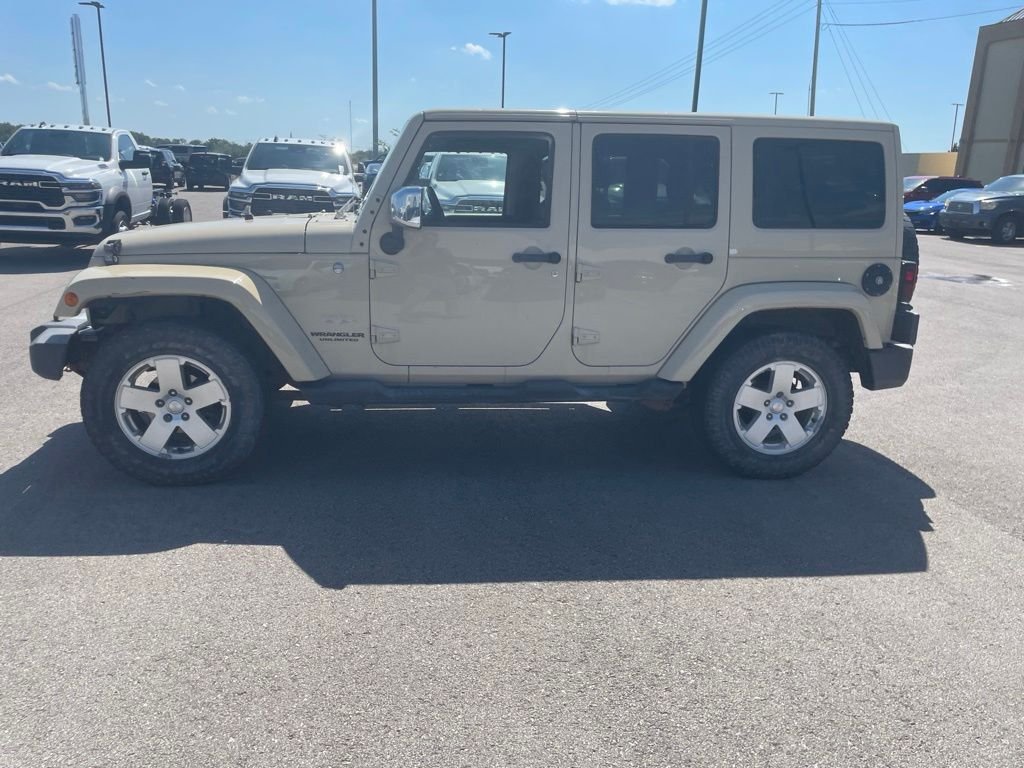 Used 2011 Jeep Wrangler Unlimited Sahara with VIN 1J4BA5H10BL530979 for sale in Kansas City