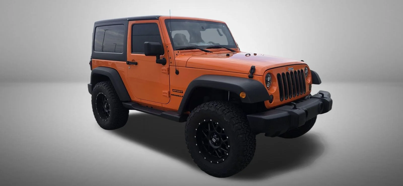 Used 2012 Orange Jeep Sport image 2