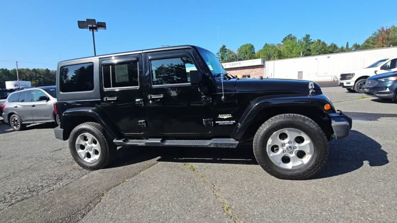 Used 2014 Black Clear Coat Jeep Sahara image 9